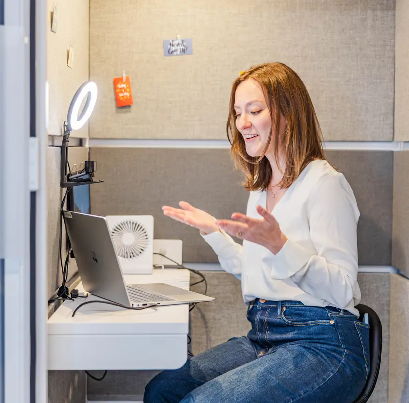 A Cookie Finance team member on a video call from a quiet work booth