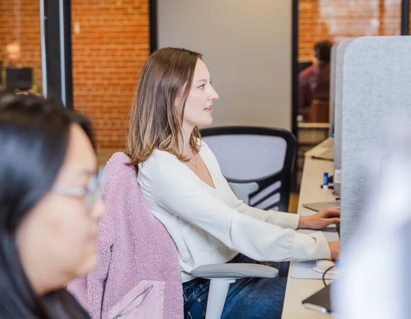 A woman working at her desk in a bright office