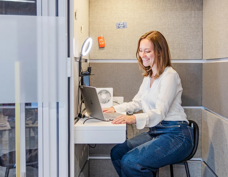 A blogger reviewing income on a laptop
