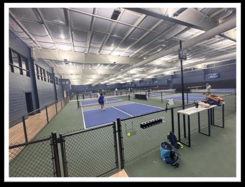 The Cooler indoor pickleball lit by HiLumz