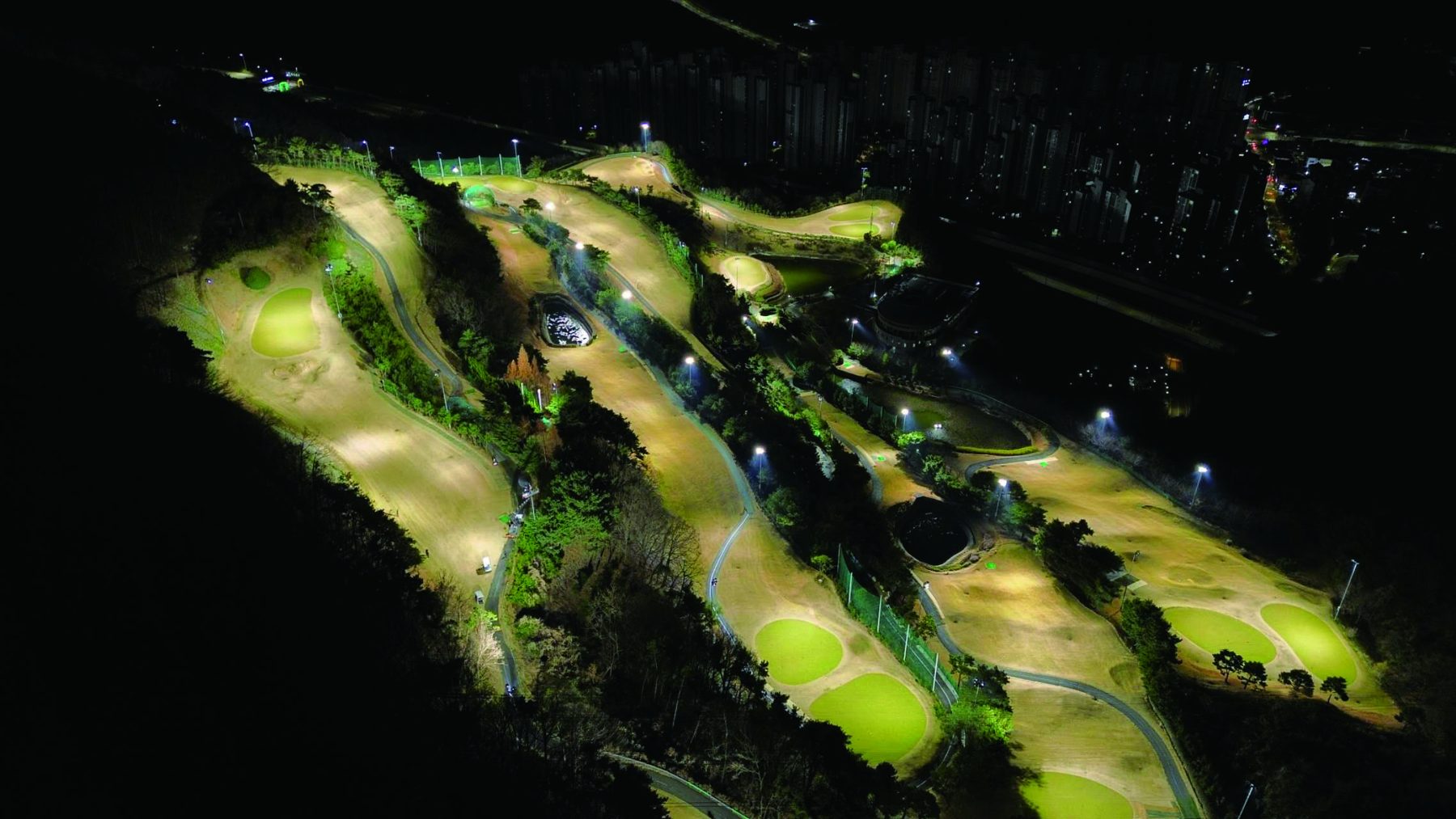 Aerial of an executive golf course lit for night play