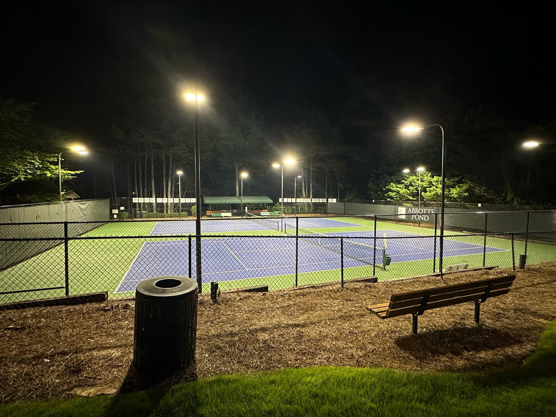 Abbotts Pond tennis courts lit at night