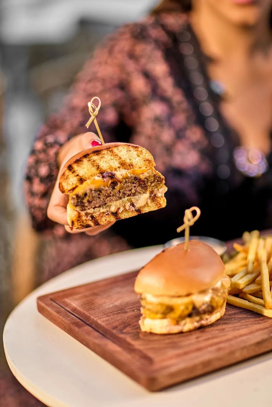 A burger lifted from the board