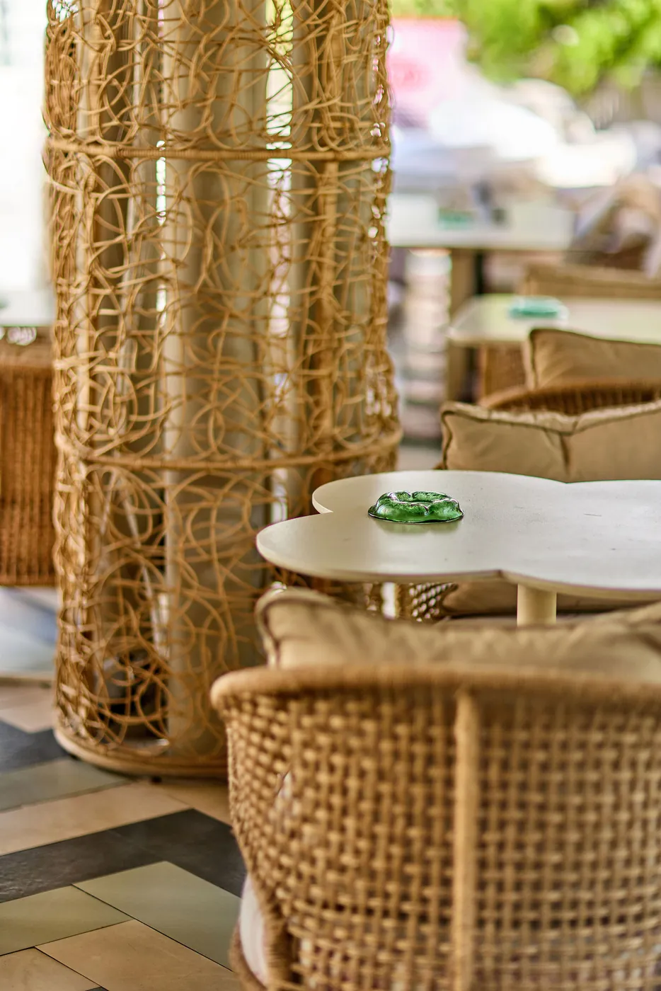 Rattan armchairs and a woven column on the terrace