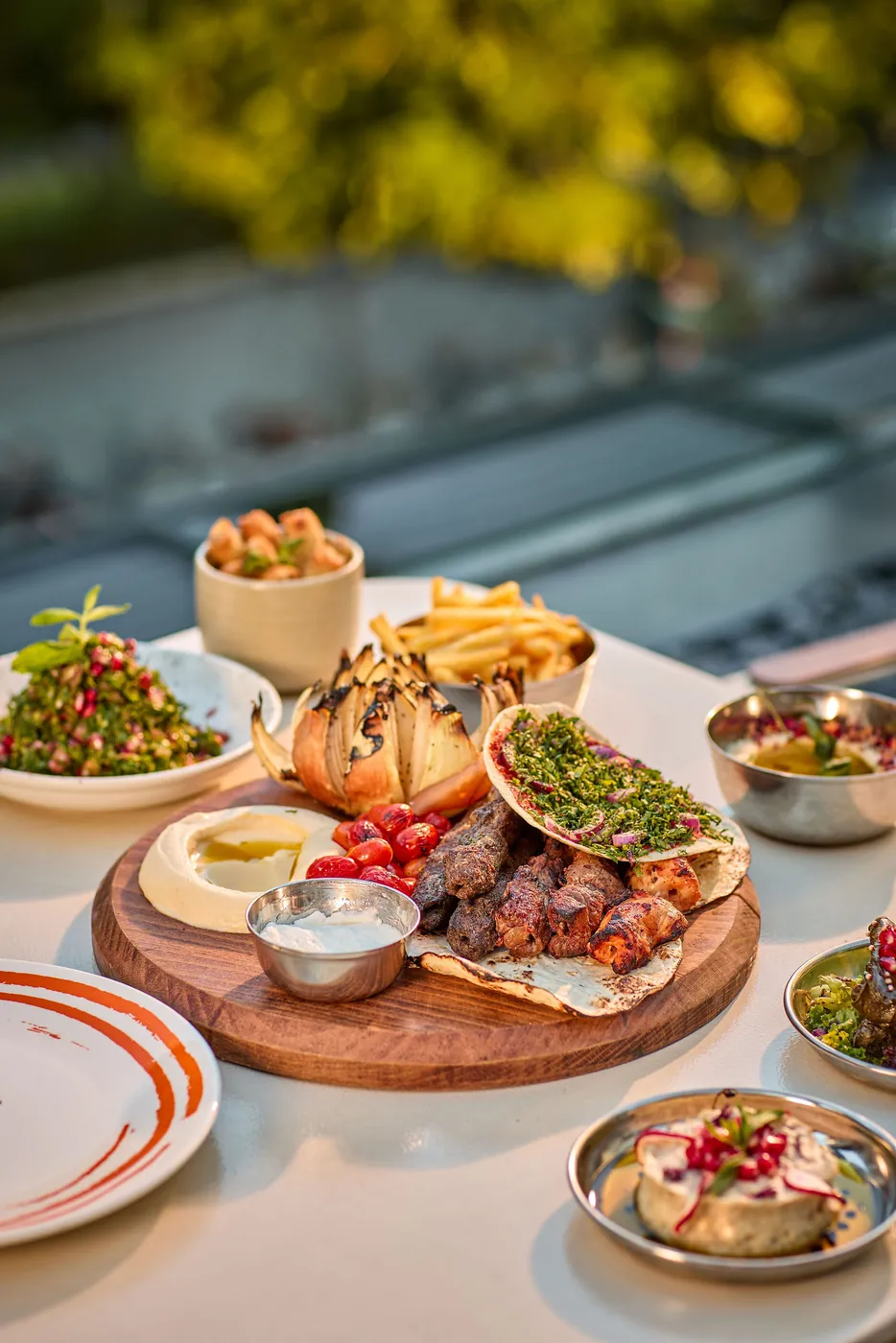 A table of mezze, grills and salads