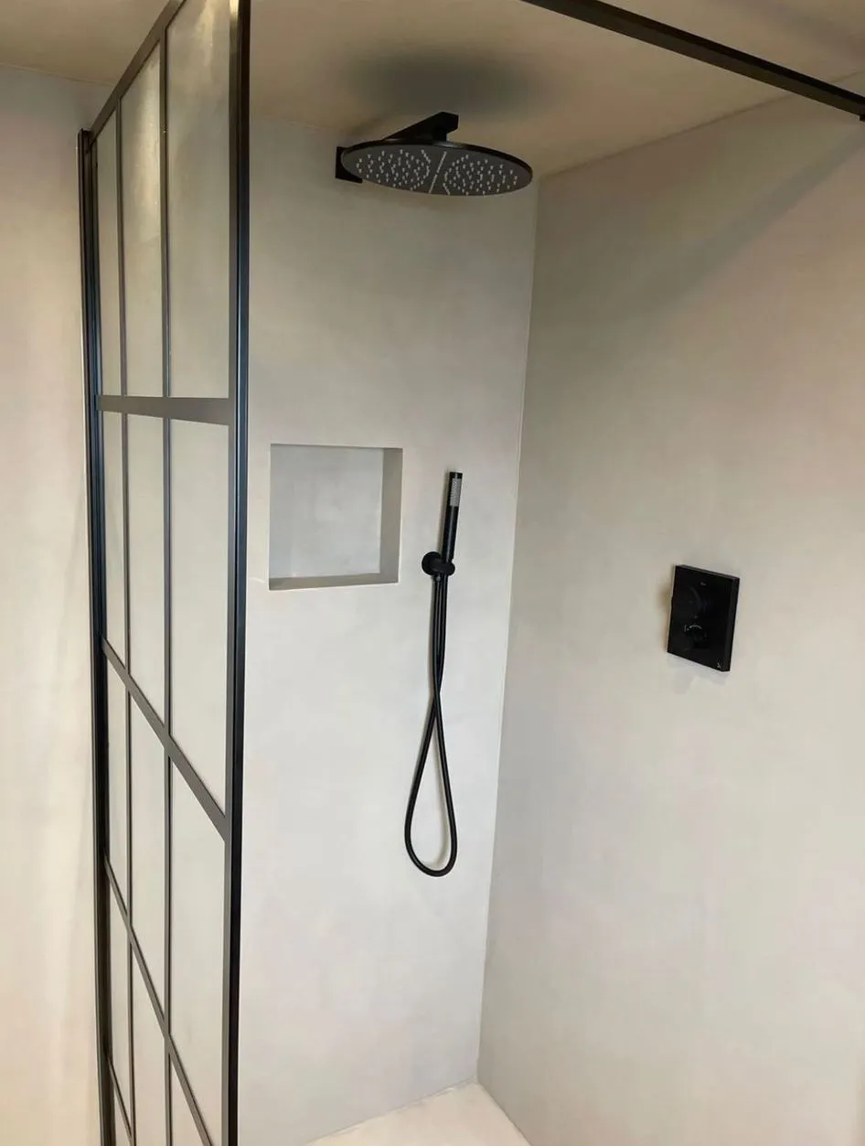 Bathroom walls prepared for finishing around a shower enclosure
