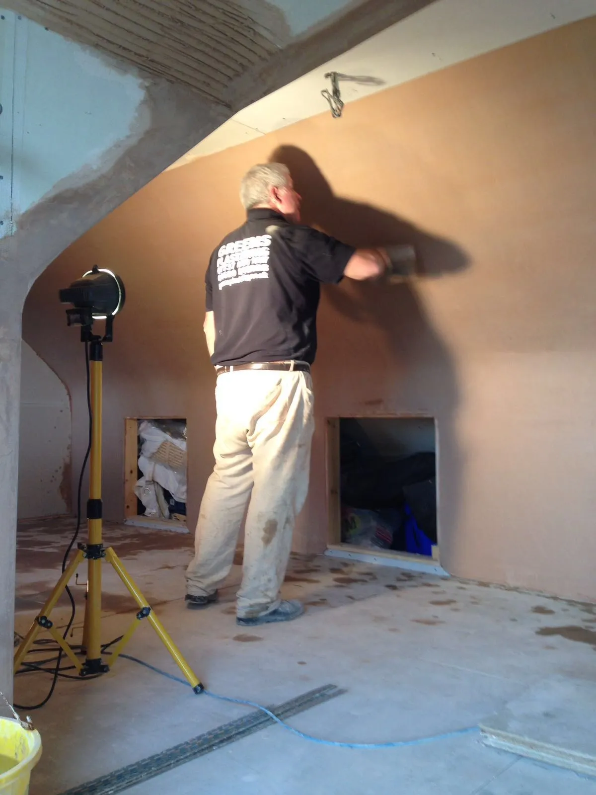 Plasterer working on an interior wall
