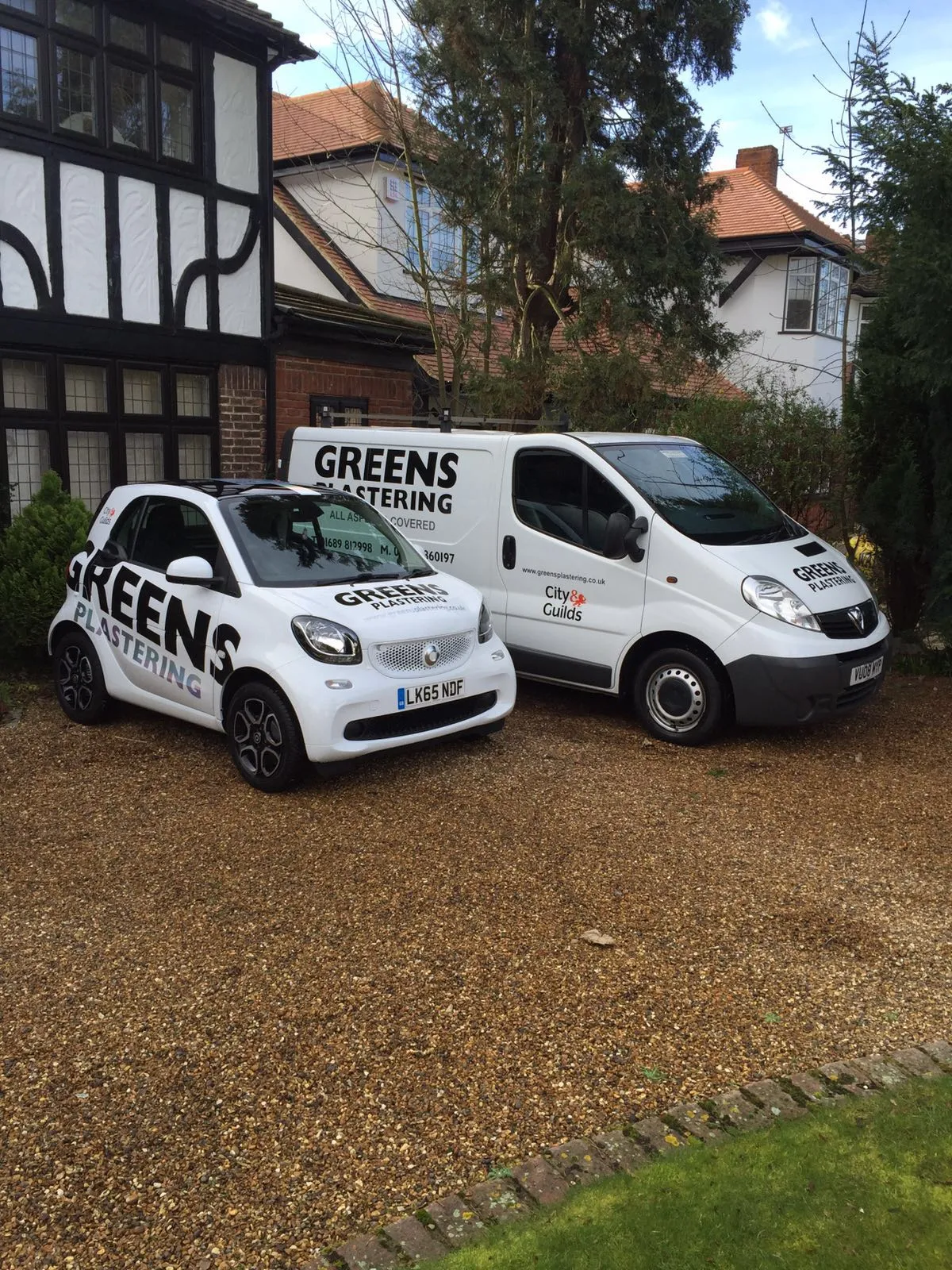 Plastering company van parked outside a property