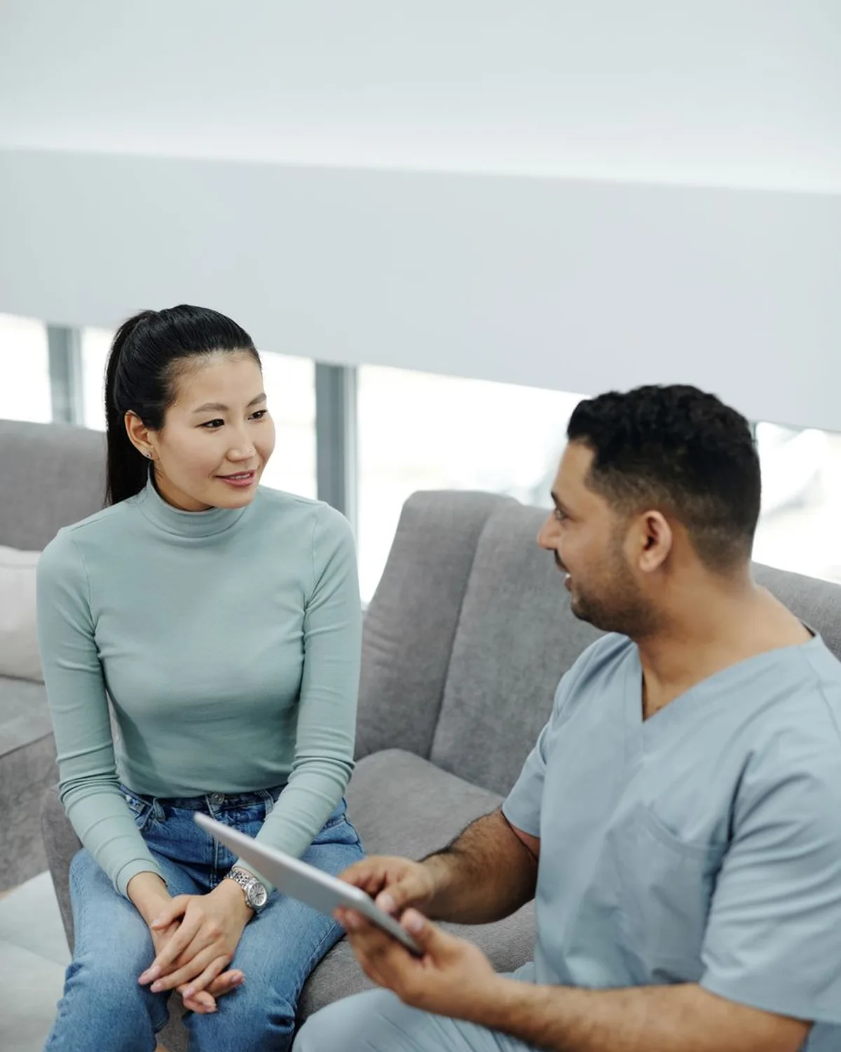 A woman talks with her doctor during a visit.