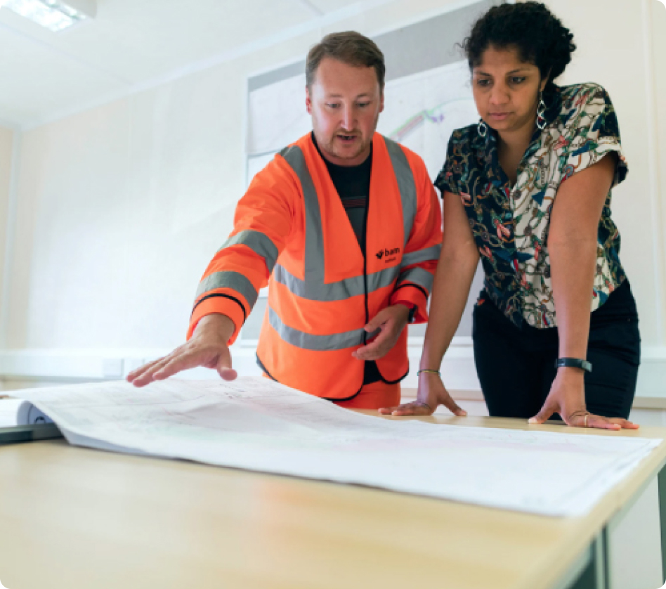 An installer and a consultant reviewing plans together
