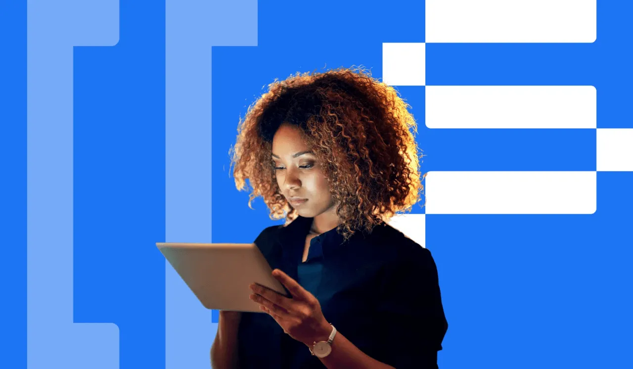 Young woman with curly hair focused on using a tablet against a blue and white geometric background.