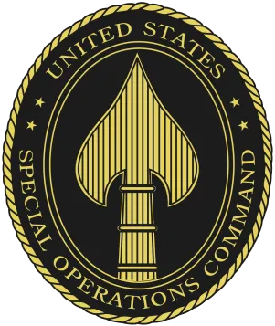 United States Special Operations Command emblem featuring a gold spearhead inside an oval with rope border and text around it on a black background.