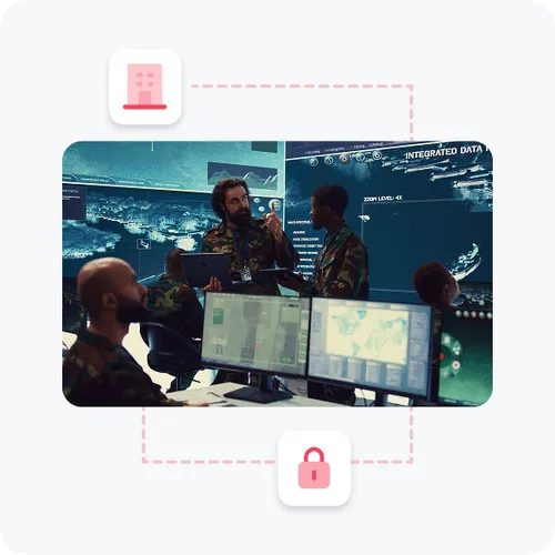 Military personnel in a command center with multiple digital screens showing maps and data, surrounded by icons of a building and a padlock connected by a dotted line.