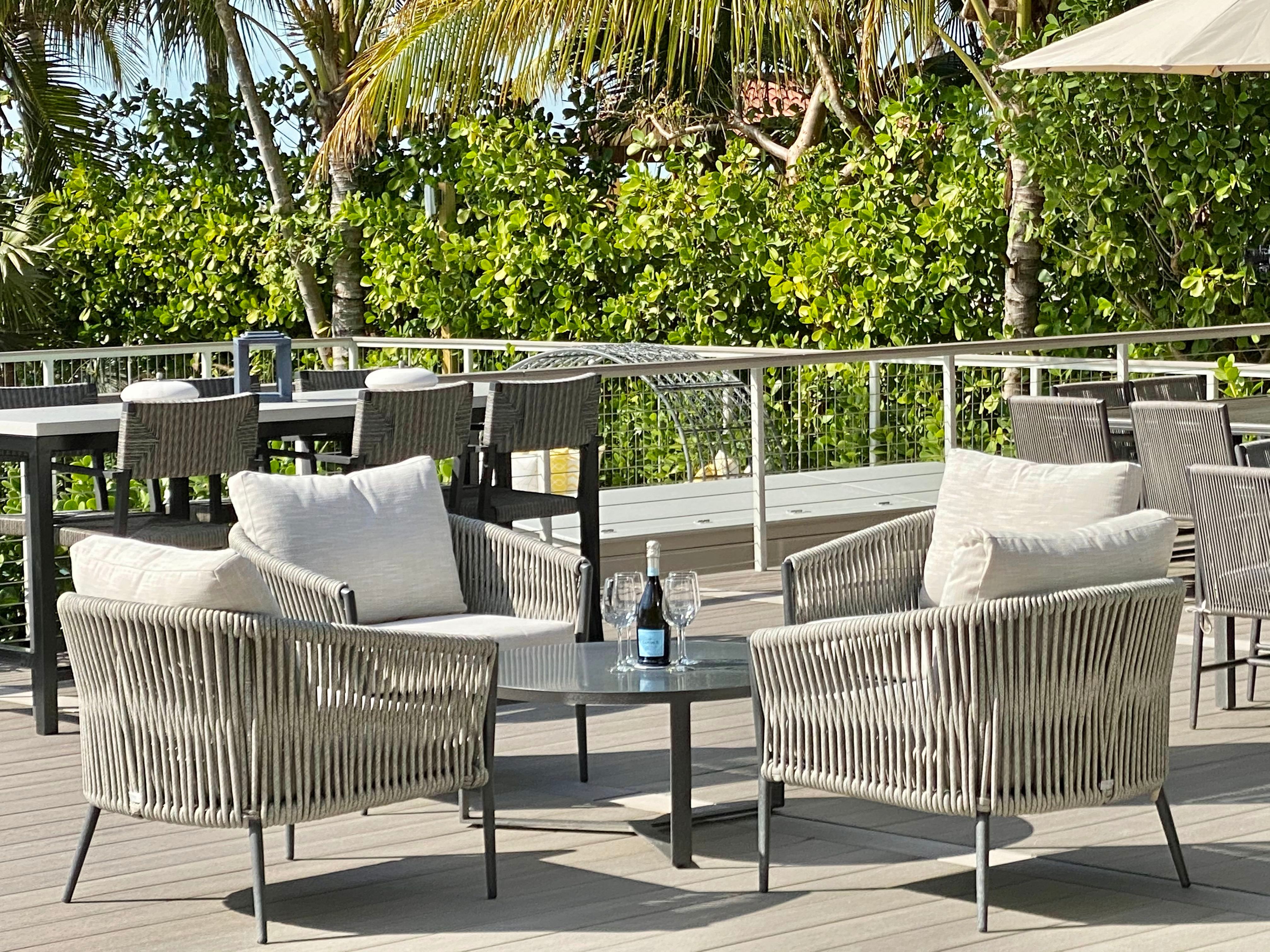 Outdoor seating under the palms