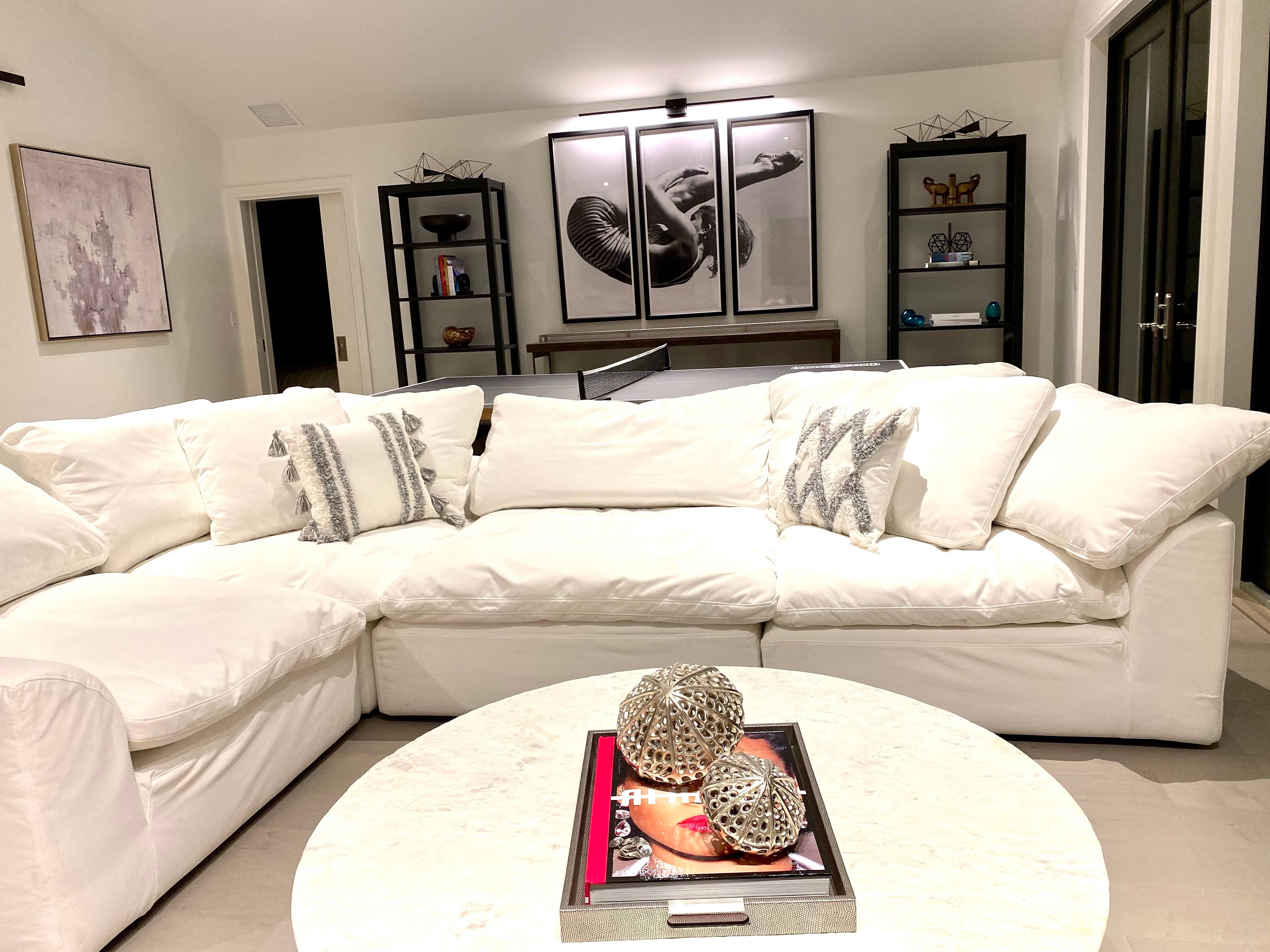 Upstairs living room with white sectional