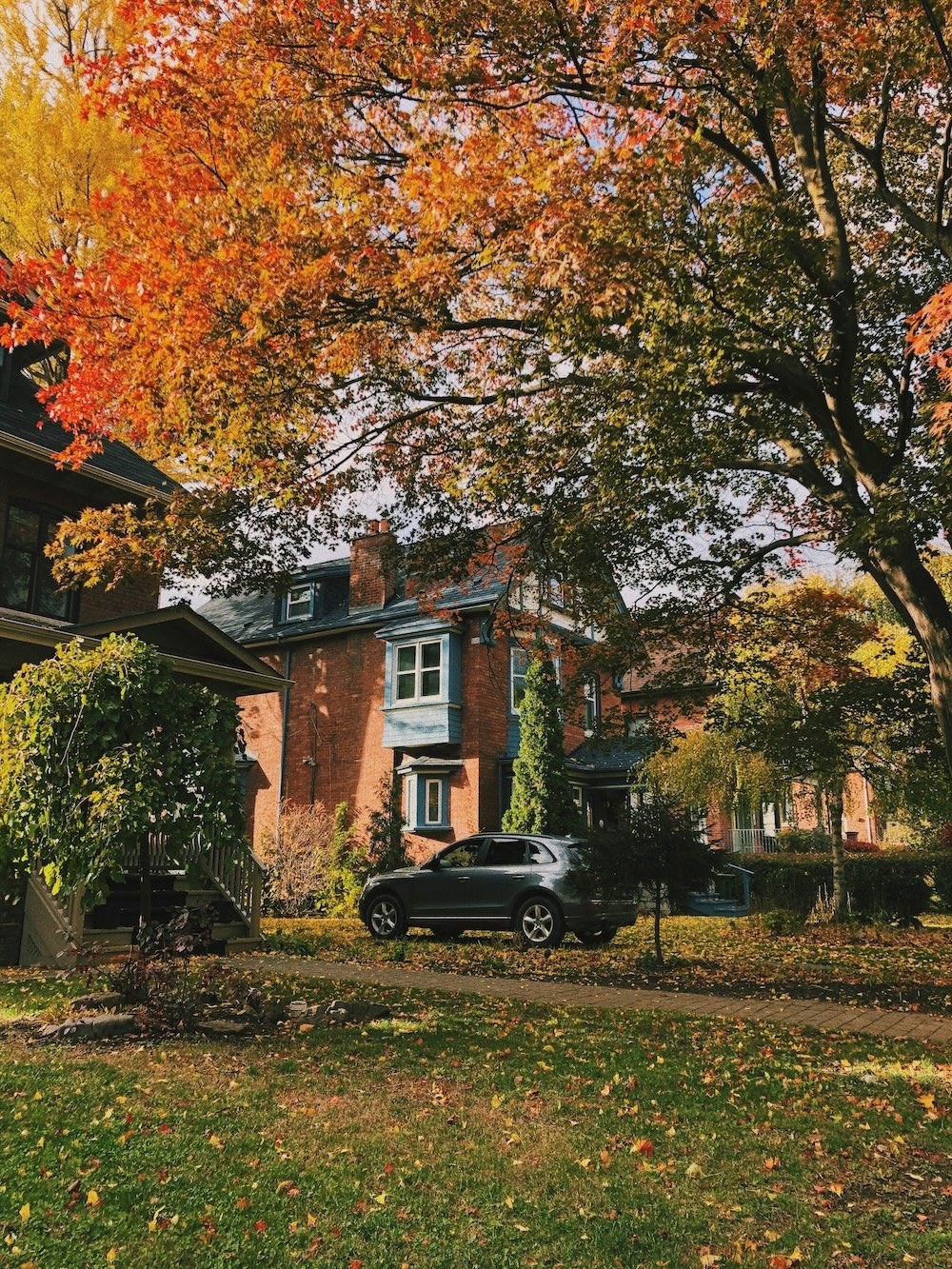 Red-brick Toronto house in autumn