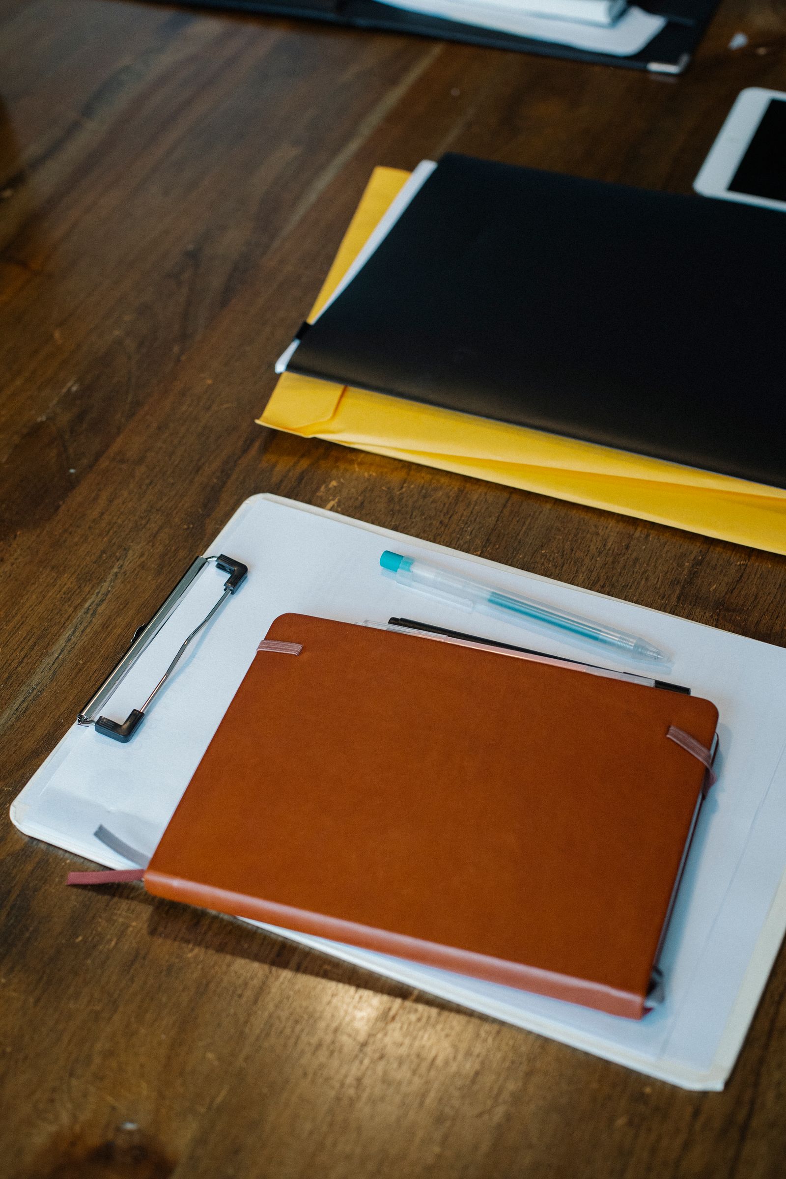 Folders and clipboard on a desk
