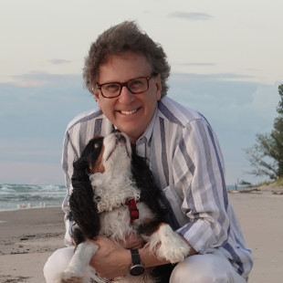 Tom Gold with his dog on the Lake Michigan shoreline
