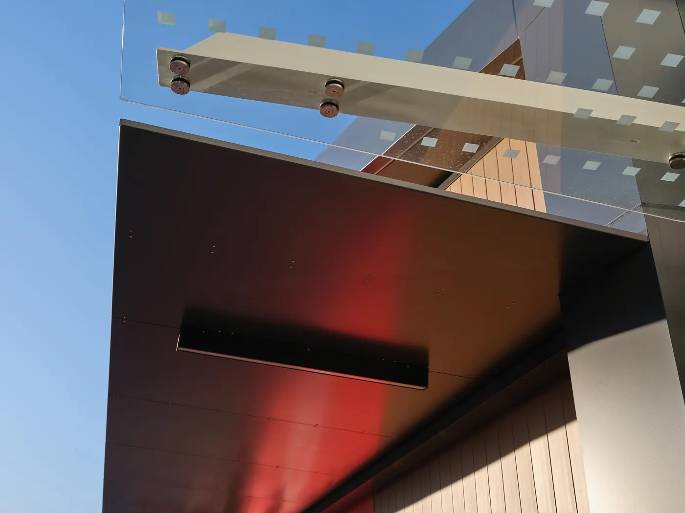 The laminated glass end above the black canopy