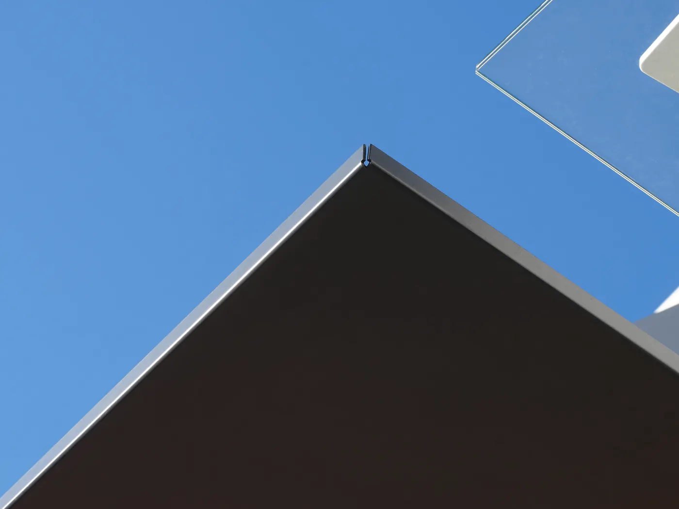 A corner of the canopy against a blue sky