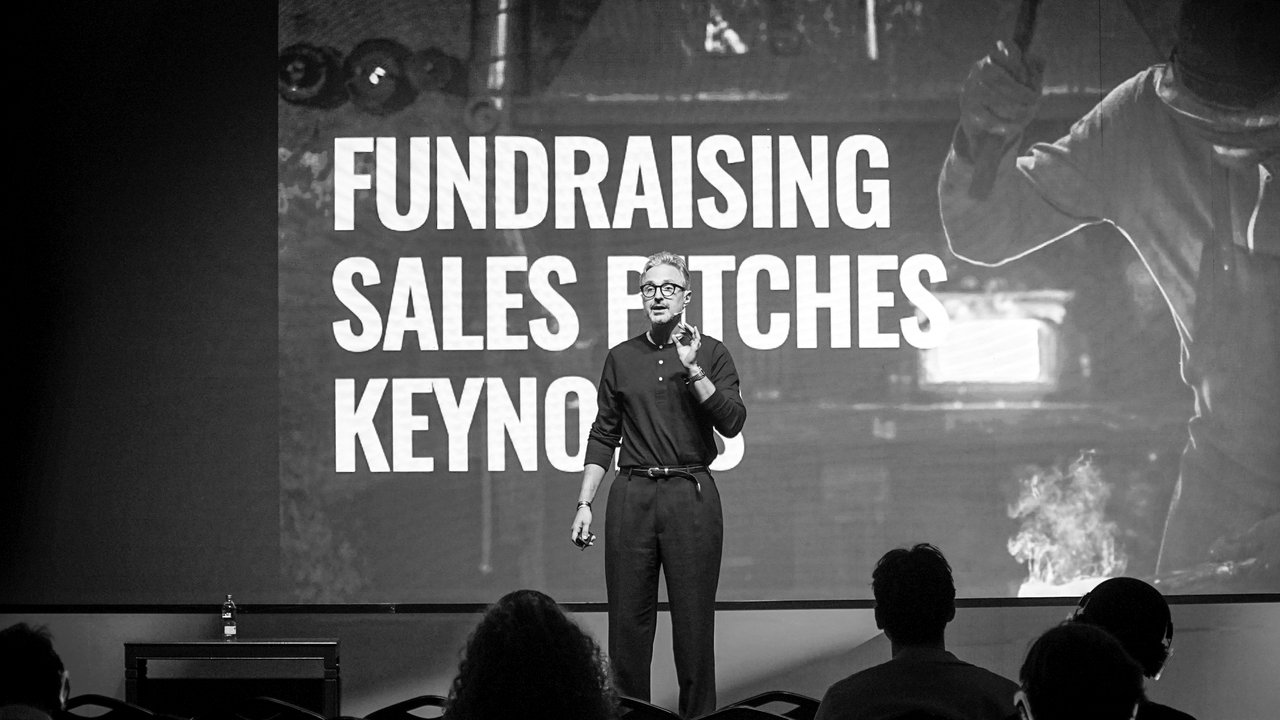Iskender Dirik giving a keynote on fundraising, sales pitches and keynotes