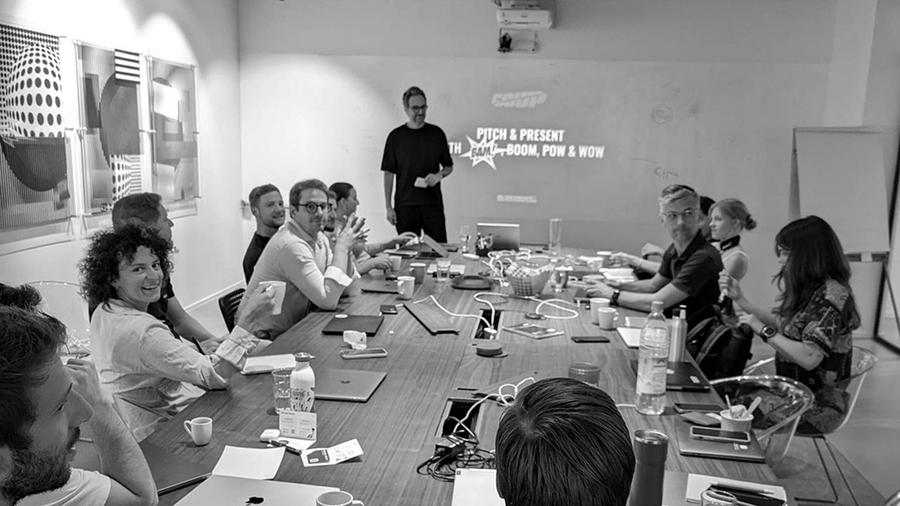 Iskender Dirik leading a COUP workshop with a team