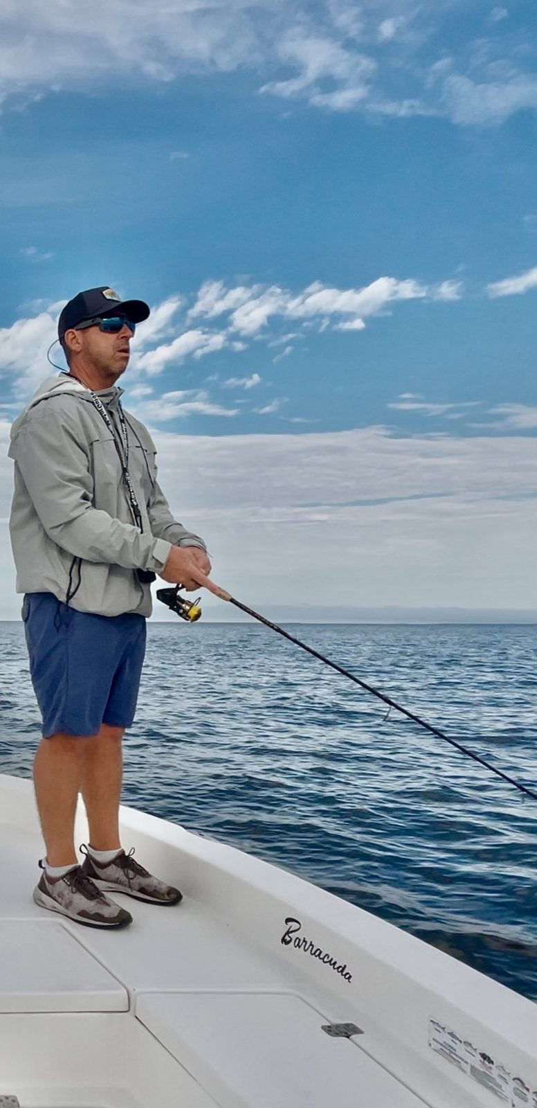 Capt Rich Damianos, USCG-licensed Master and owner of Reel Rich Fishing Charters, fishing from the bow of the Un-Reel on Charlotte Harbor