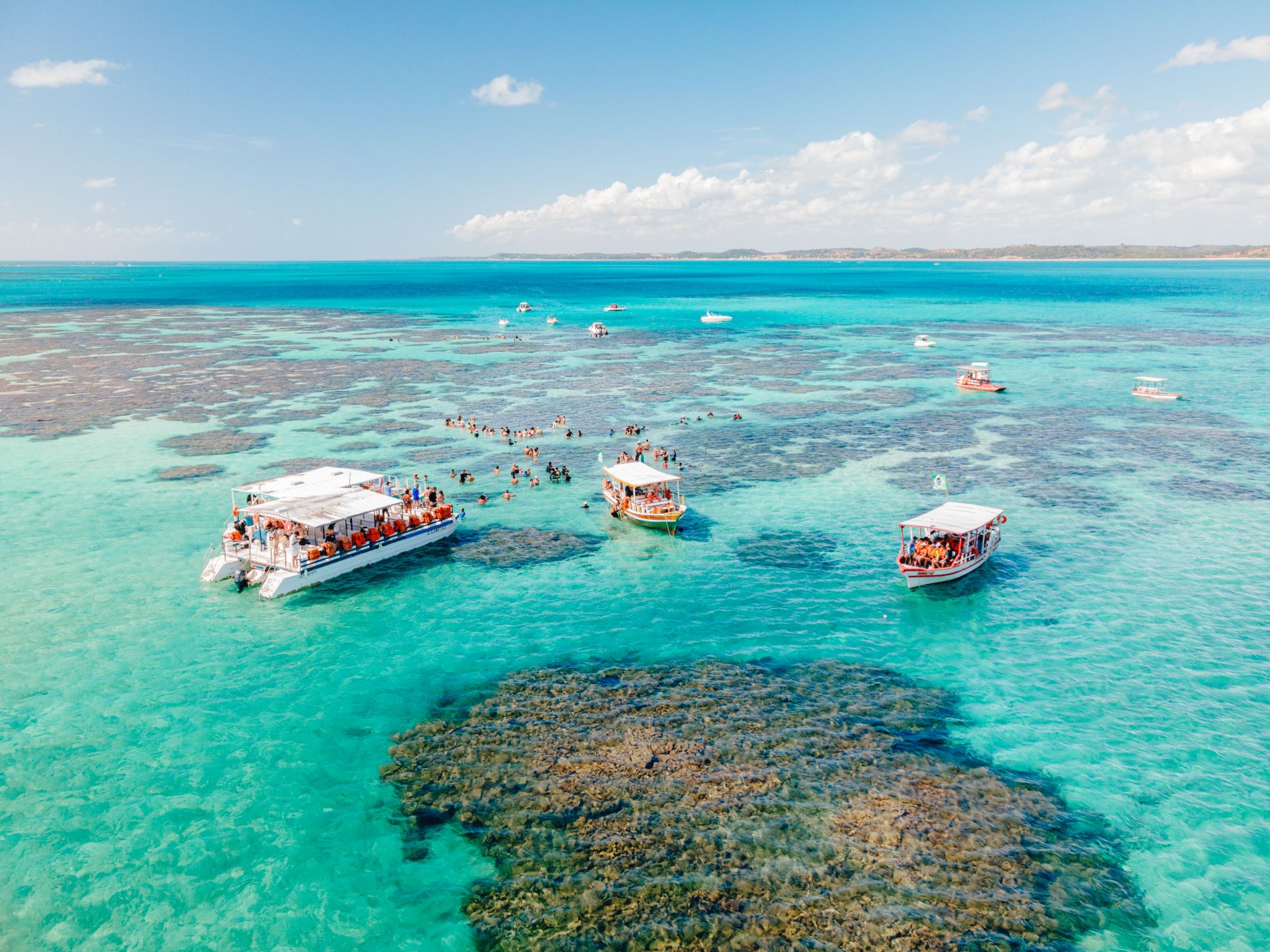 Catamarans at the Galés natural pools in Maragogi