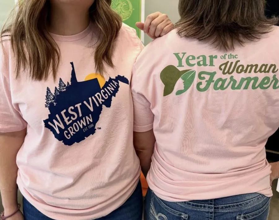Pink shirts printed with West Virginia Grown and Year of the Woman Farmer