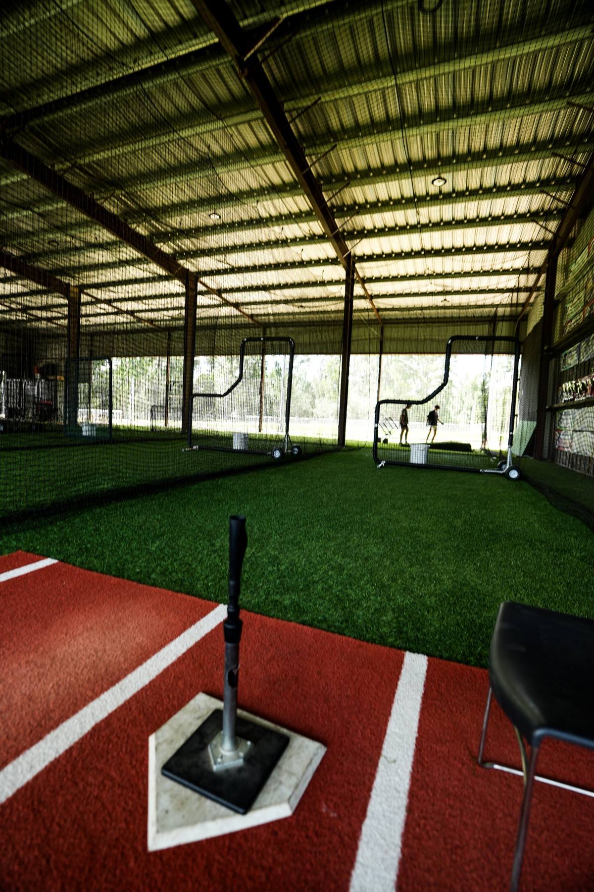 Batting tee on home plate inside the DrillBit cages