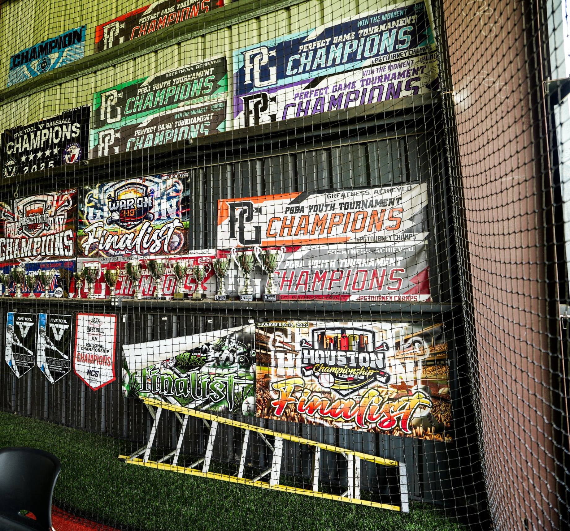 Wall of championship banners inside the DrillBit facility