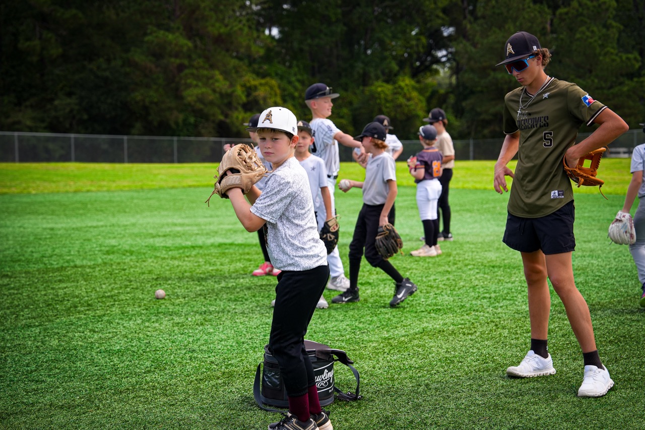 Coach working with young players at a DrillBit camp