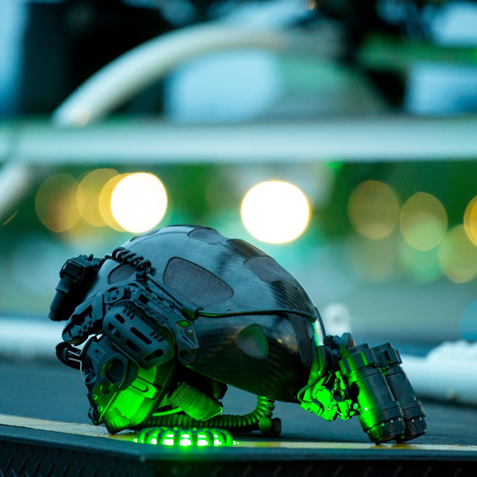 RATH carbon fiber helmet with NVGs on a helicopter landing deck at dusk