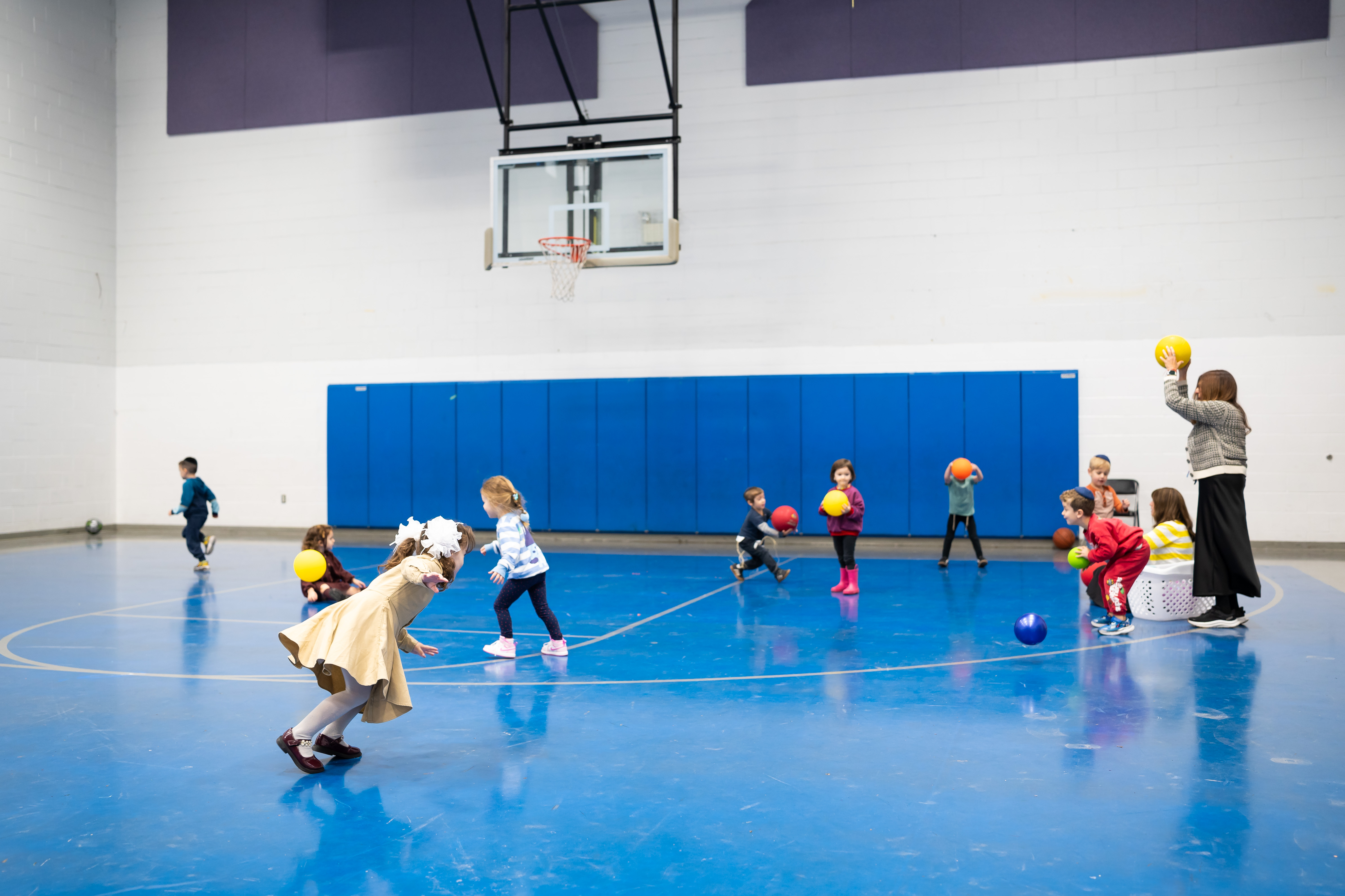 Children playing in the full-size gym