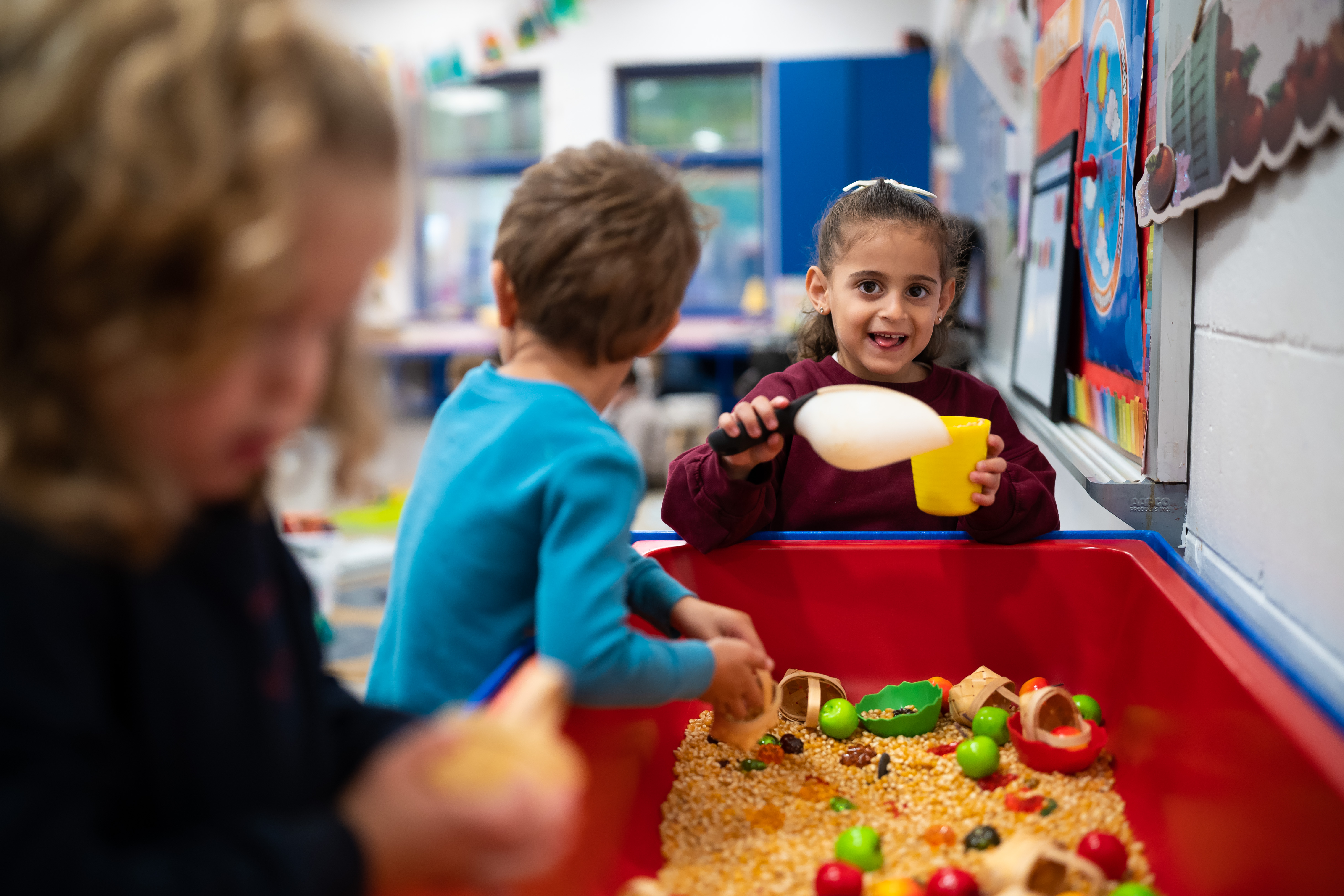 Children exploring a sensory bin
