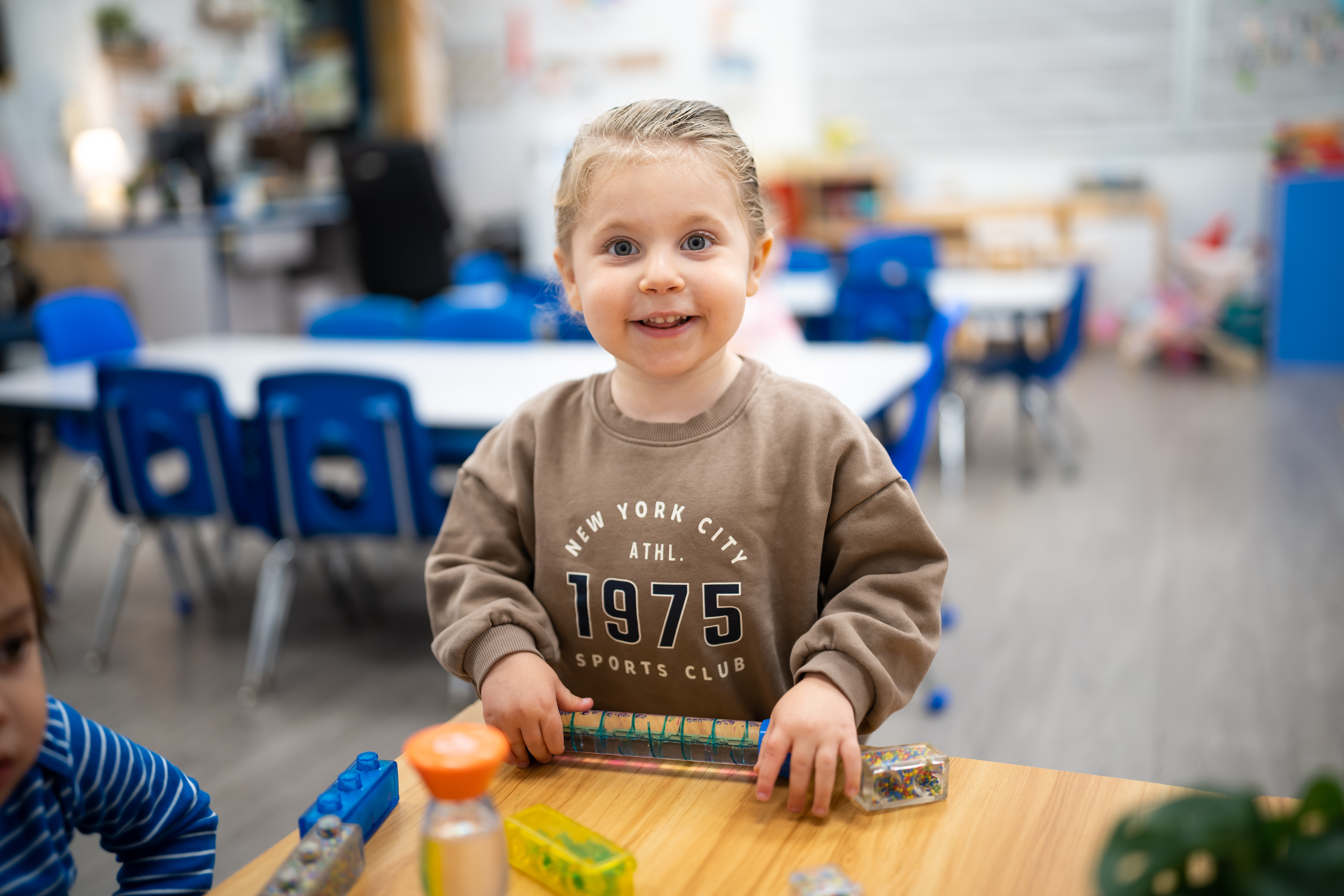 Smiling preschooler at the table