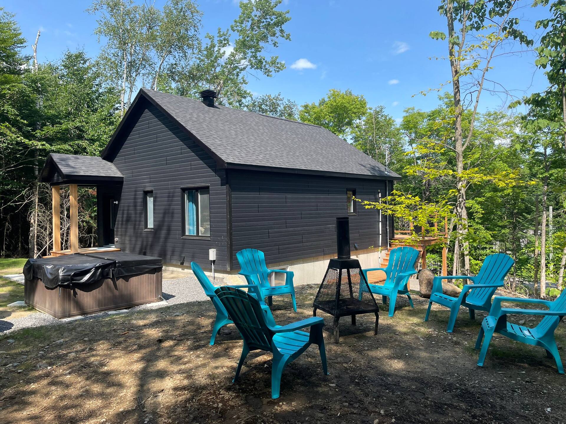 Chalet front with Adirondack chairs