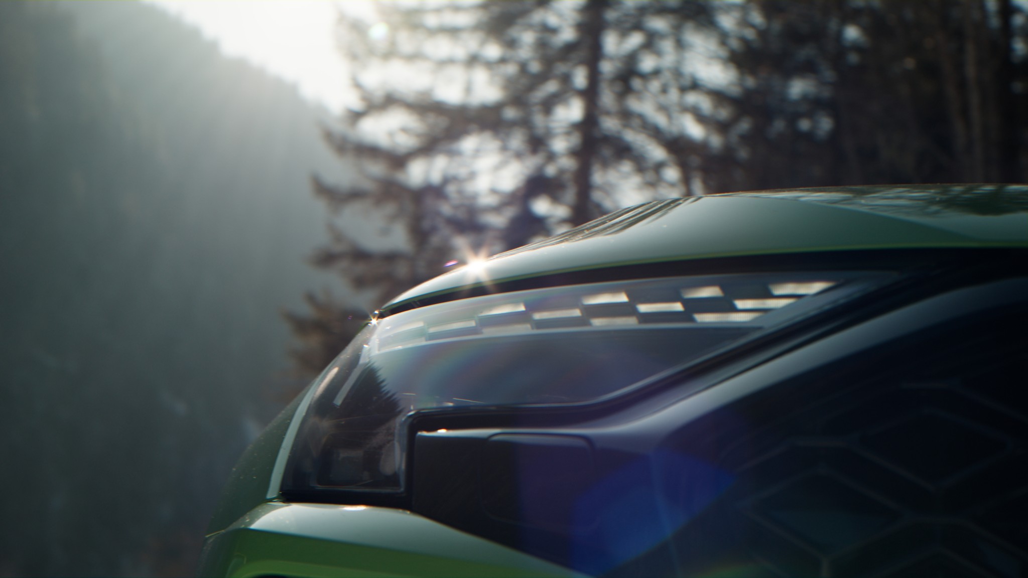 Frontscheinwerfer eines grünen Audi im Wald, Szene aus dem Audi-Trailer