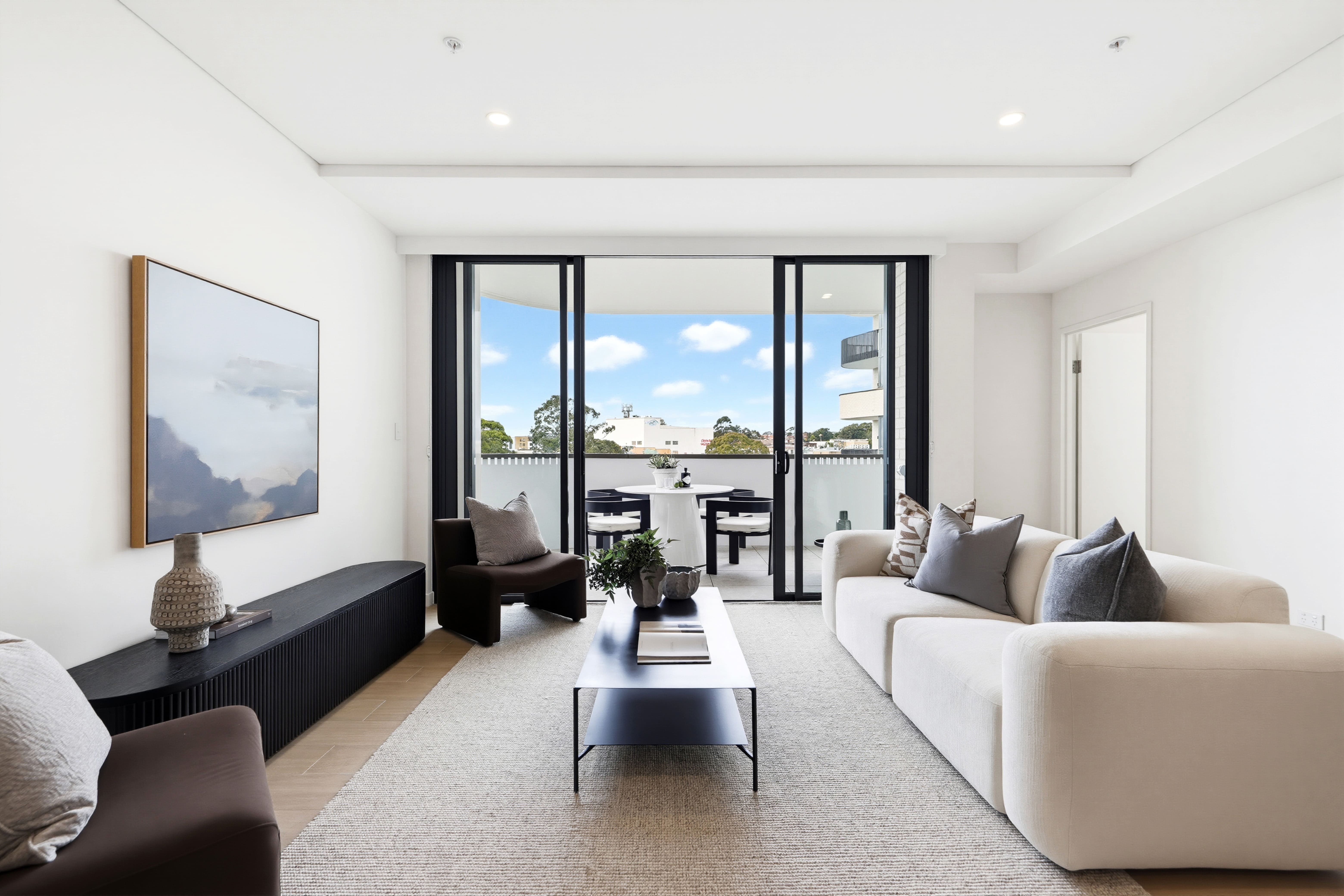 Living area of the furnished three-bedroom display apartment at Caringbah Pavilion