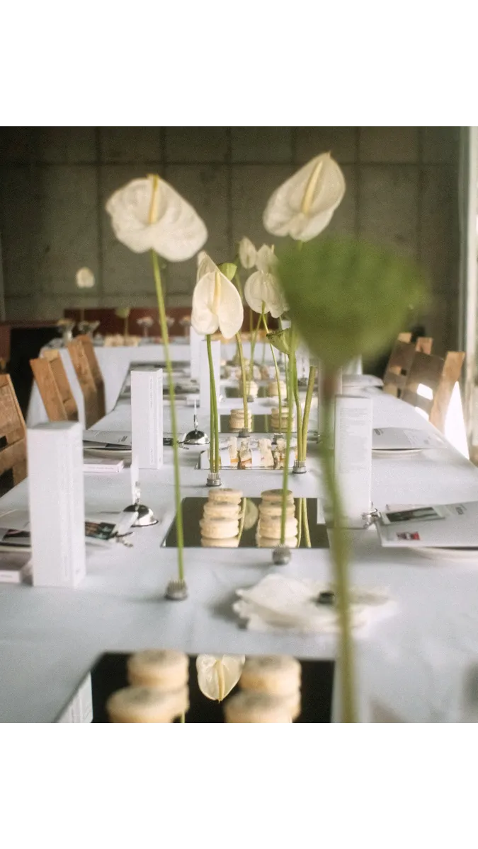 MGN Society tablescape with branded gift bag, printed place cards, and floral styling