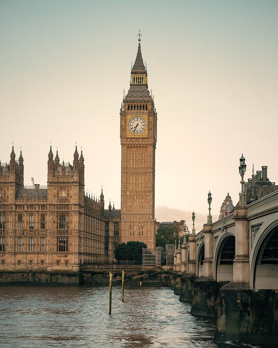 Big Ben, the Houses of Parliament and Westminster Bridge in warm evening light