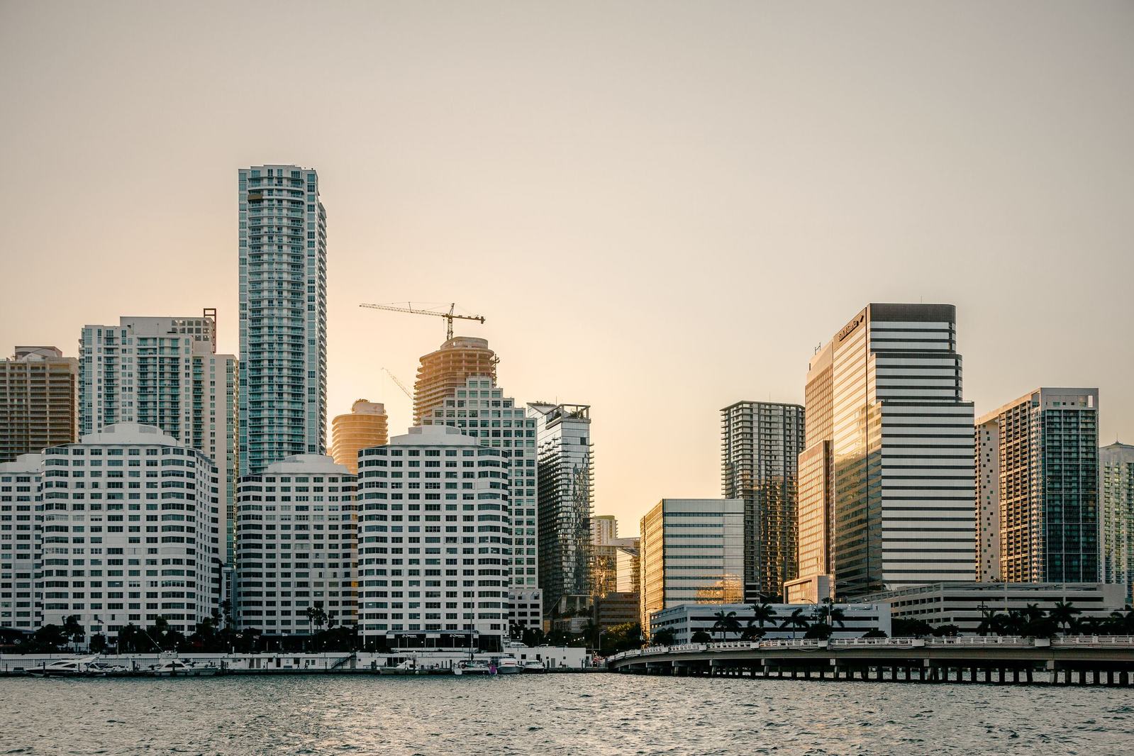 Brickell waterfront skyline across Biscayne Bay in soft warm light