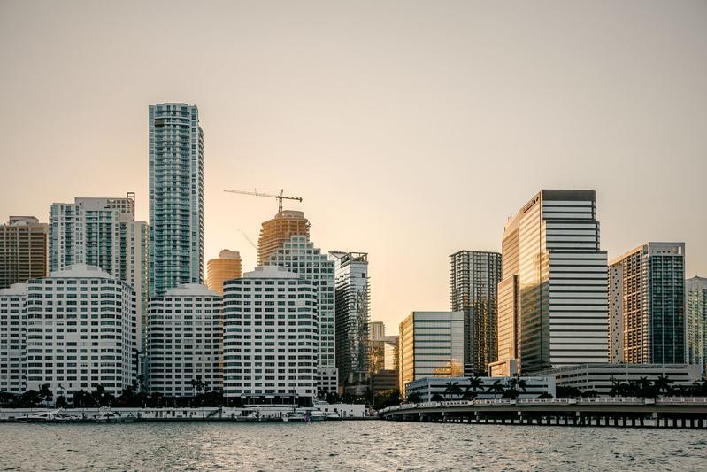 Brickell waterfront skyline across Biscayne Bay in soft warm light