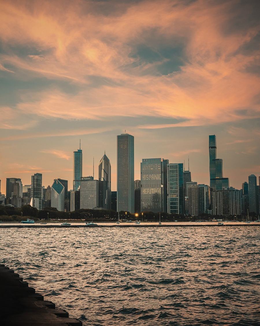 Chicago skyline across Lake Michigan at sunset