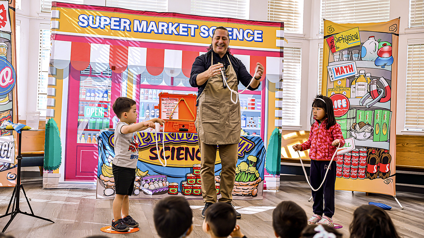 JamesZini performing SuperMarket Science for a school audience