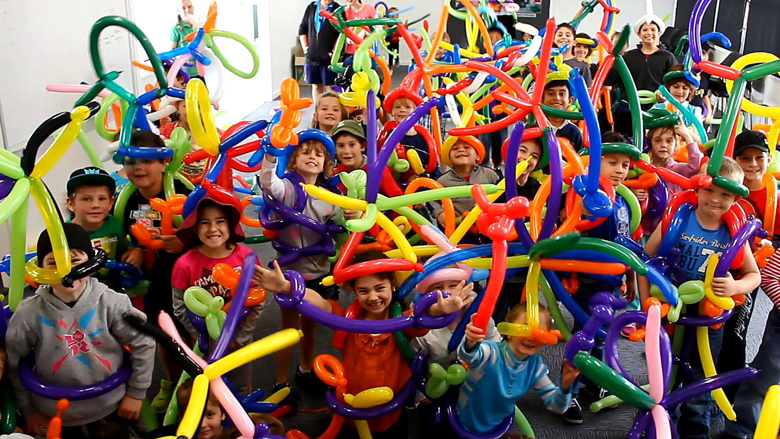 Participants celebrating with balloons at a creative workshop