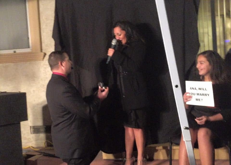 James proposing to Ana during the magic routine at her surprise birthday party