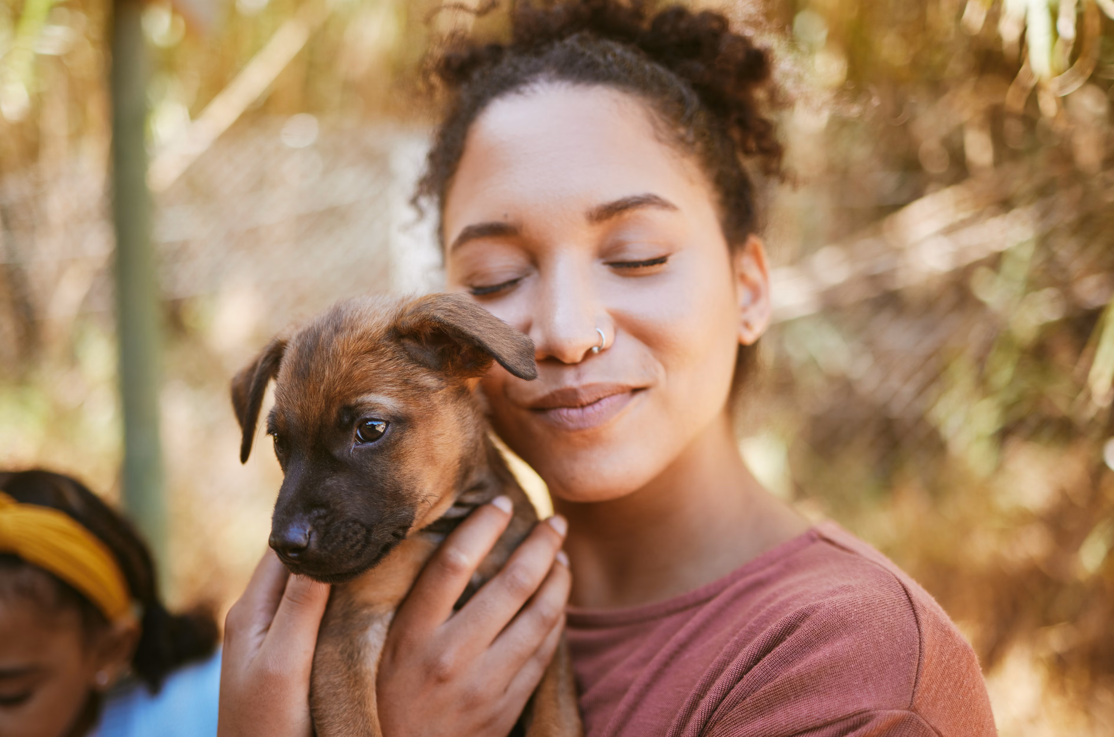 Volunteer holding a rescued puppy