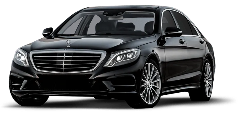Black Mercedes-Benz luxury sedan viewed from front-left angle with distinctive grille and LED headlights.
