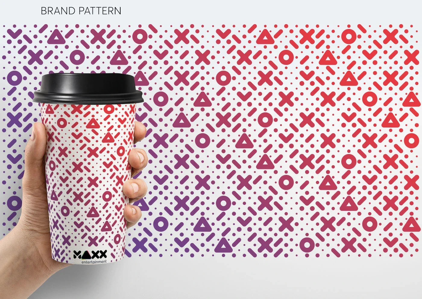 MAXX Entertainment pattern on a takeaway cup